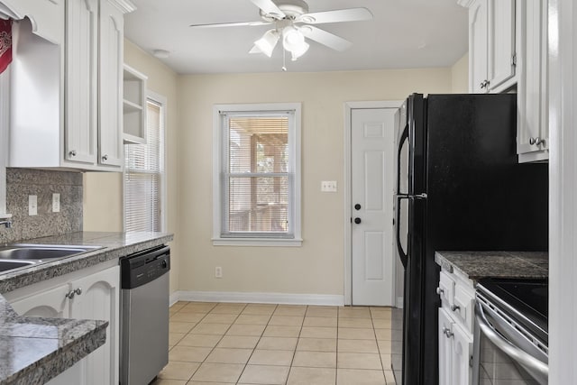 kitchen featuring light tile patterned floors, sink, white cabinetry, backsplash, and stainless steel appliances