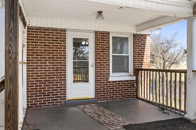 entrance to property featuring covered porch