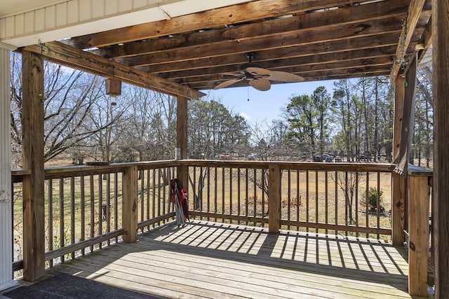 wooden terrace featuring ceiling fan