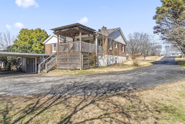 exterior space with a carport and a porch