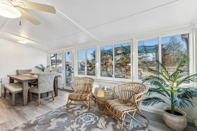 sunroom / solarium featuring ceiling fan