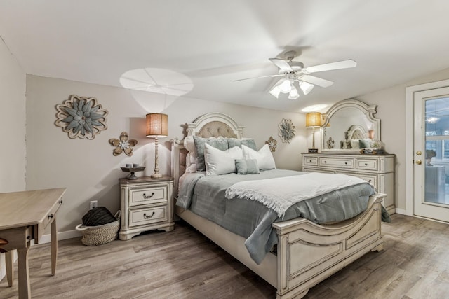 bedroom with ceiling fan, hardwood / wood-style flooring, and access to outside