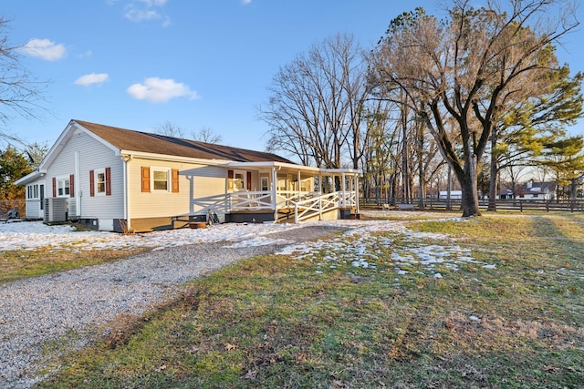 view of side of home featuring a porch