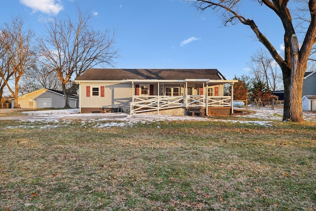 view of front of house with a yard and a porch