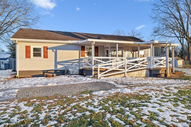 view of front of house featuring a sunroom