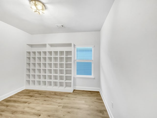 spare room with light hardwood / wood-style flooring