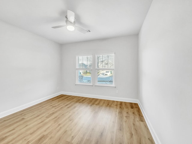 spare room with ceiling fan and light hardwood / wood-style floors