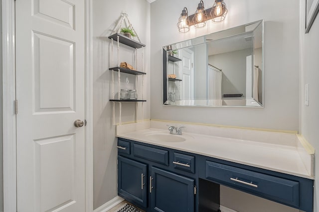 bathroom with walk in shower and vanity