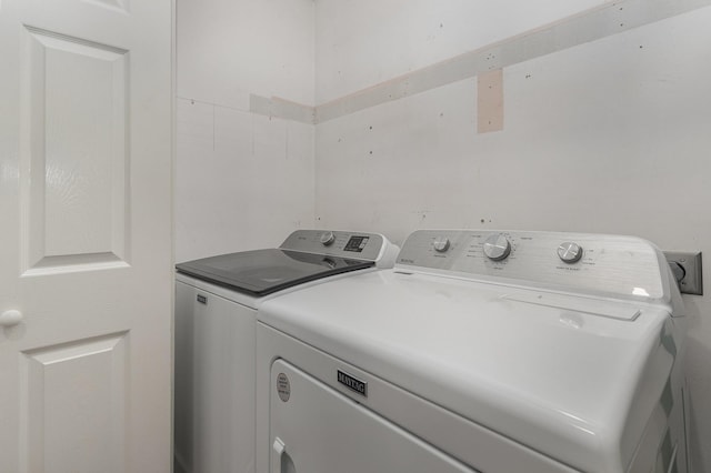 washroom with separate washer and dryer