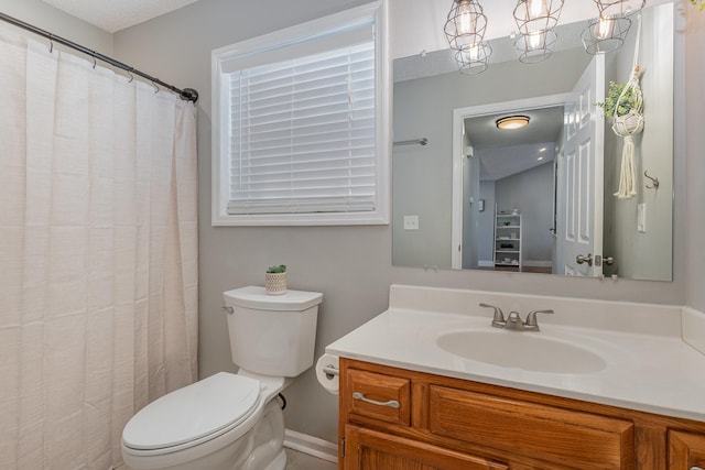 bathroom with toilet and vanity