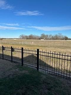 view of yard with a rural view