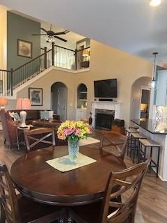 dining room with ceiling fan and wood-type flooring