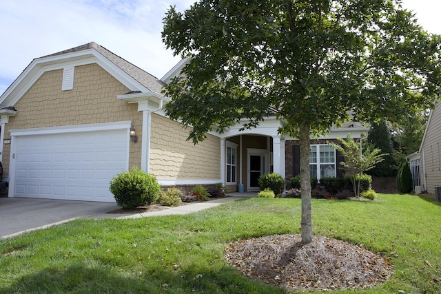 view of front facade with a front yard and a garage