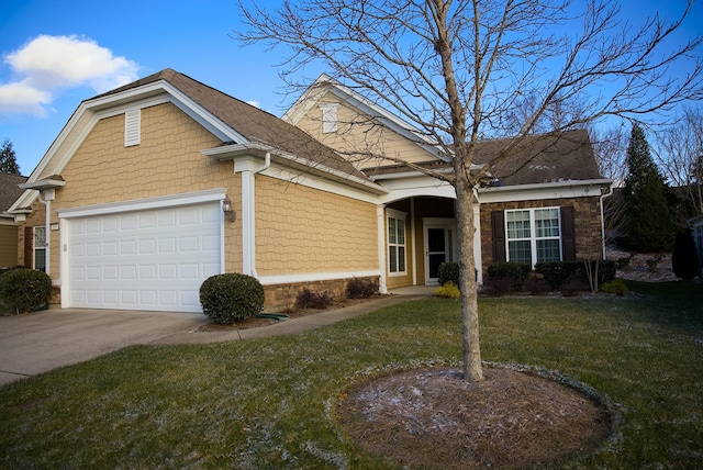 view of front of house with a front yard and a garage