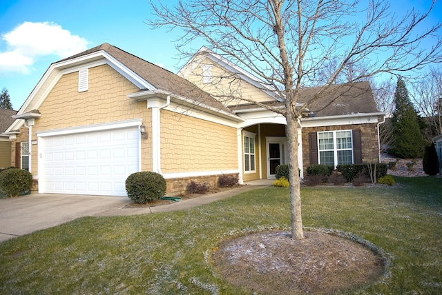 view of front of property featuring a garage and a front yard