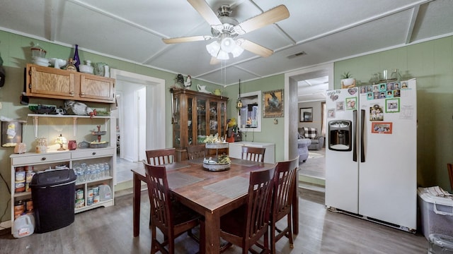 dining space featuring ceiling fan and hardwood / wood-style flooring