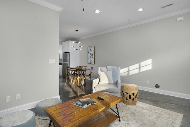 living room with ornamental molding and a chandelier