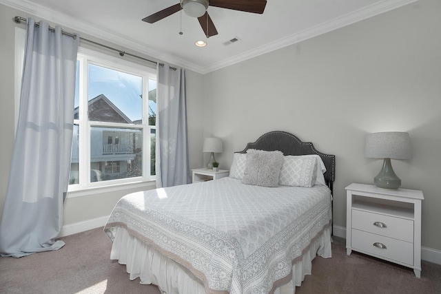 carpeted bedroom featuring ceiling fan and crown molding