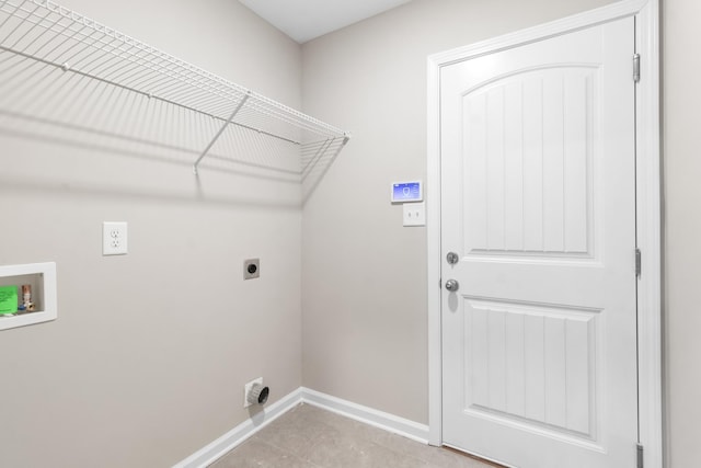 laundry area featuring light tile patterned floors, hookup for a washing machine, and electric dryer hookup