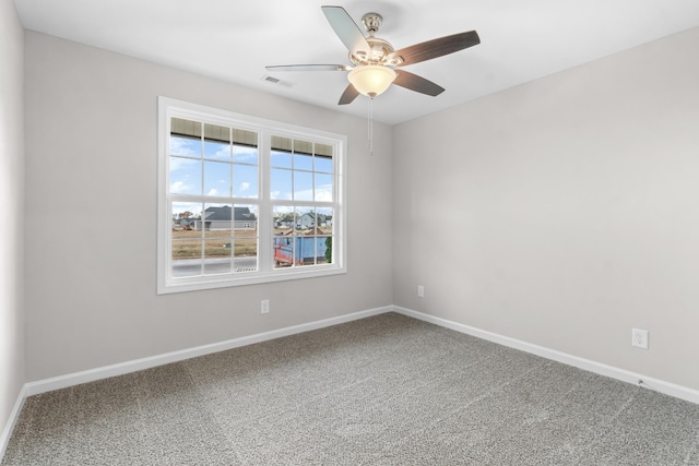 empty room featuring ceiling fan and carpet flooring