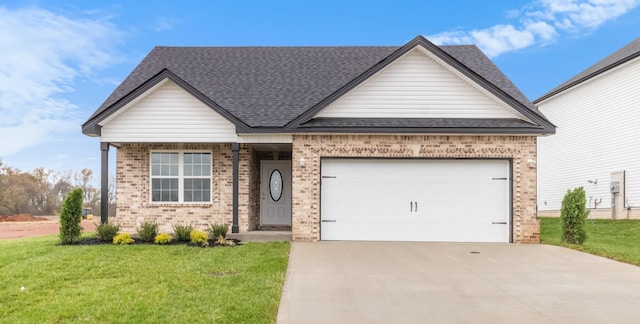 view of front of home with a front lawn and a garage