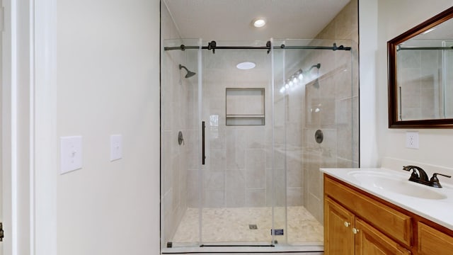 bathroom with vanity and walk in shower