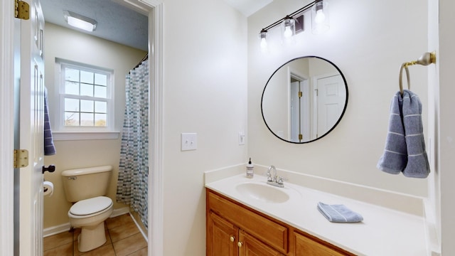 bathroom with walk in shower, tile patterned floors, toilet, and vanity