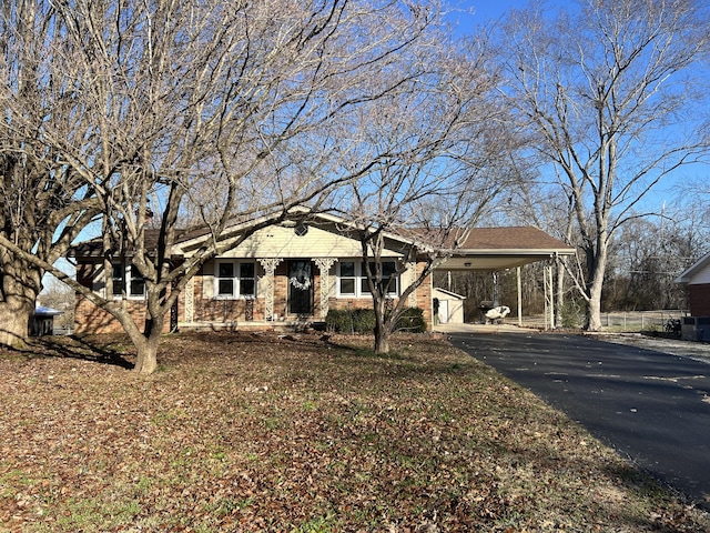 single story home featuring a carport