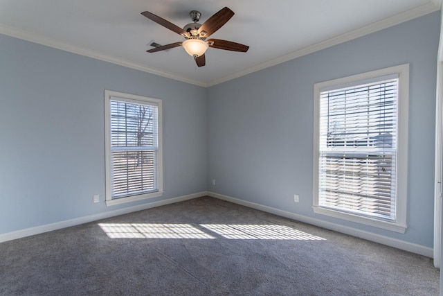 carpeted spare room with ceiling fan and ornamental molding