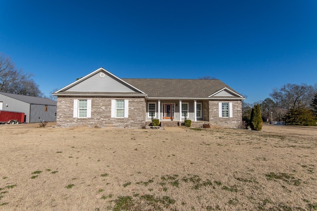 view of front facade with a porch and a front yard