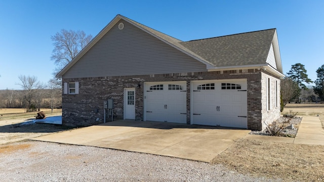 view of side of home with a garage