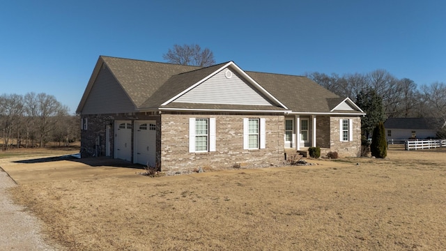 view of front facade with a garage and a front yard