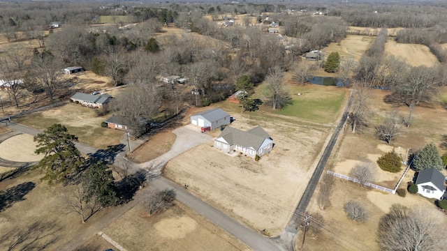 birds eye view of property with a rural view