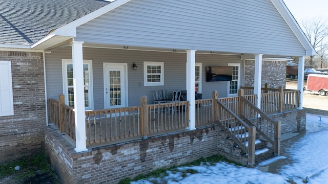 wooden deck featuring covered porch