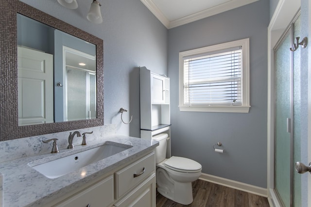 bathroom featuring a shower with shower door, wood-type flooring, vanity, and crown molding