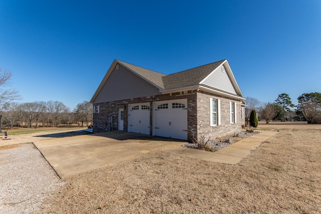 view of side of home featuring a garage