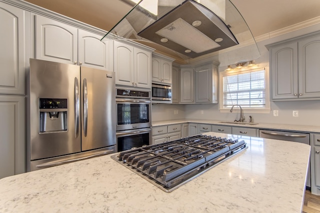 kitchen featuring gray cabinets, stainless steel appliances, light stone counters, and sink