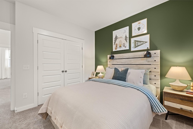 carpeted bedroom featuring a closet