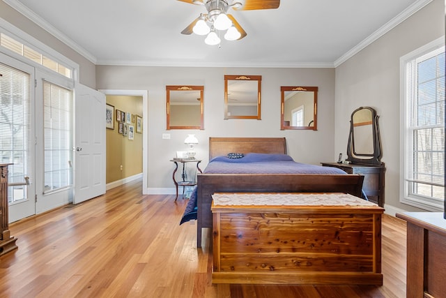 bedroom featuring multiple windows, light hardwood / wood-style floors, access to exterior, ornamental molding, and ceiling fan