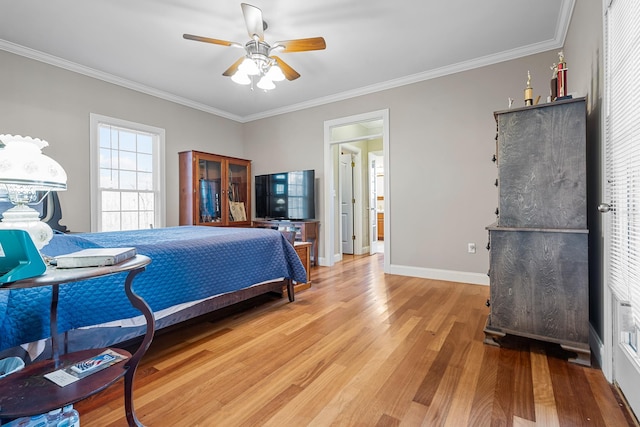 bedroom featuring ceiling fan, ornamental molding, and hardwood / wood-style floors