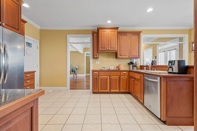 kitchen featuring light tile patterned floors, appliances with stainless steel finishes, sink, and crown molding