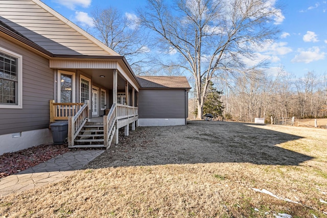 view of side of property featuring a yard