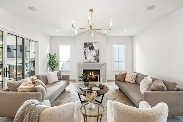 living room with plenty of natural light, a premium fireplace, and recessed lighting