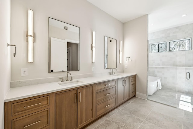 bathroom with double vanity, a soaking tub, a sink, and a shower stall