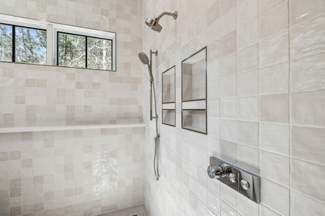 bathroom with tiled shower