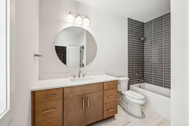 bathroom featuring tub / shower combination, vanity, and toilet