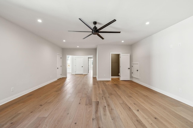 unfurnished living room featuring light wood-style flooring, baseboards, ceiling fan, and recessed lighting