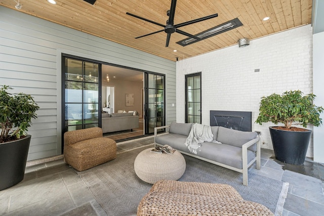 view of patio featuring ceiling fan and an outdoor living space