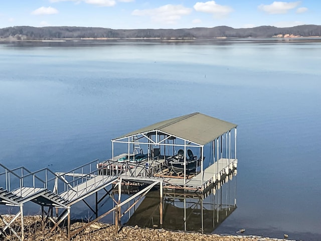 dock area featuring a water and mountain view