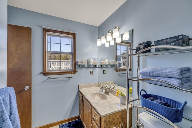 bathroom with plenty of natural light and vanity